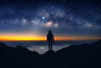 Silhouette of photographer with camera and milky