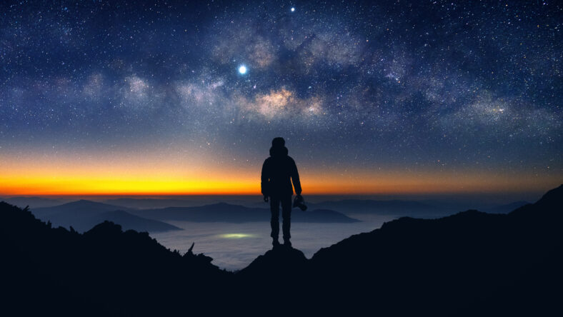 Silhouette of photographer with camera and milky