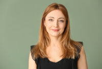 Portrait of mature woman on color background