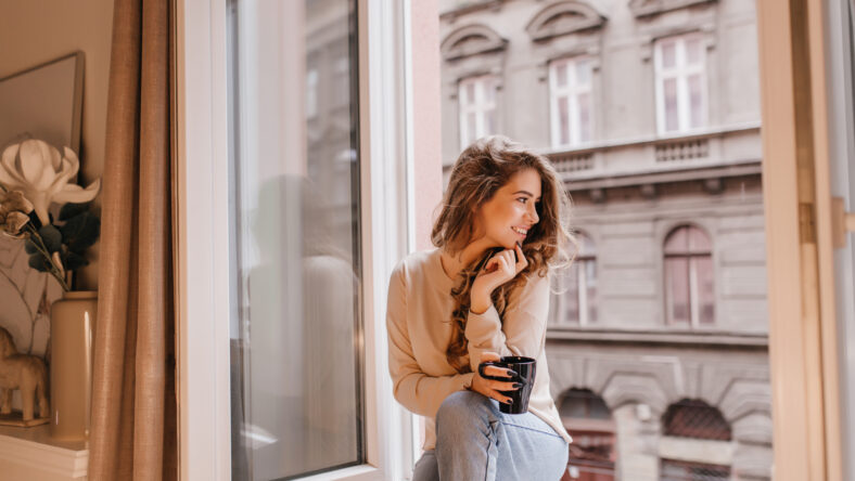 Romantic female model in good mood looking