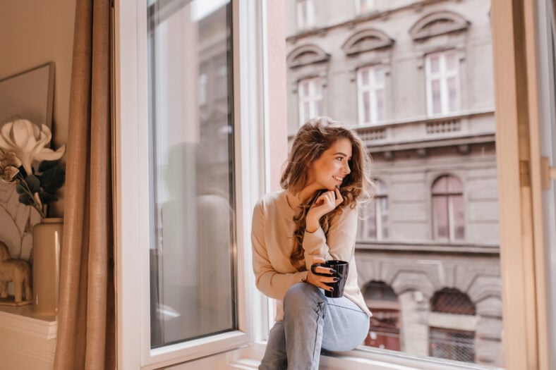 Romantic female model in good mood looking