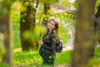Pregnant schoolgirl. Attractive pregnant woman in dress