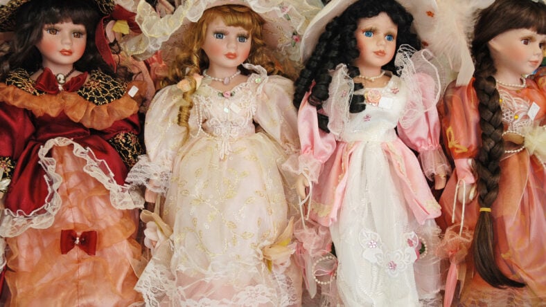 Porcelain dolls wearing dresses