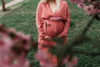 Beautiful pregnant women in pink outfit photographed