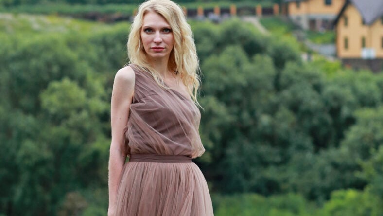blonde girl in lavender field in summer