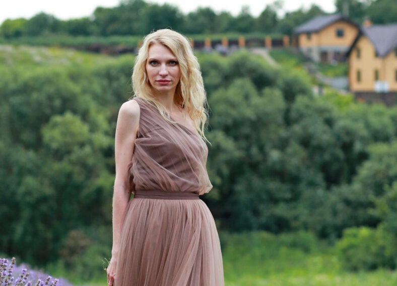 blonde girl in lavender field in summer