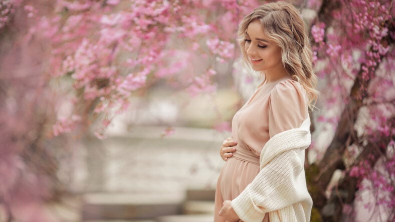 Young beautiful blonde pregnant girl in a