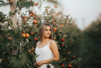 Beautiful young blonde woman in white dress