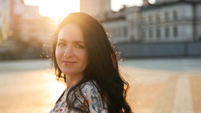 Pretty young woman with long curly hair