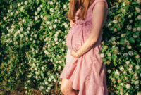 Pregnant woman's belly close up, without her