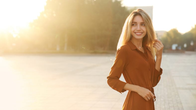 Beautiful young woman in stylish red dress