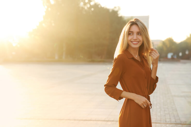 Beautiful young woman in stylish red dress