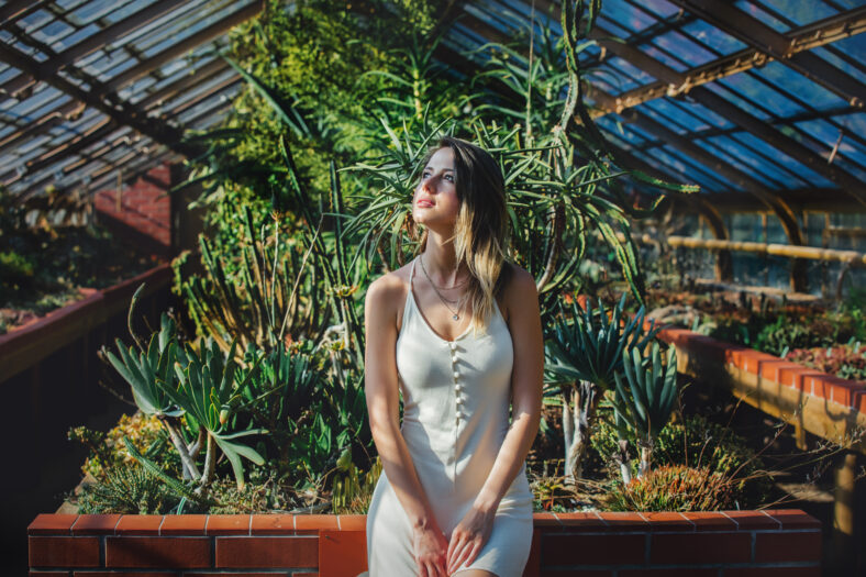 young woman in a white dress in
