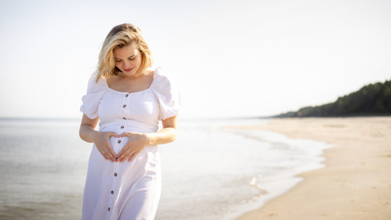 Happy pregnant woman spending time on a