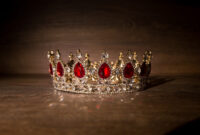Royal golden crown with red stones. King,