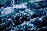 Dramatic sea waves storm from aerial view.