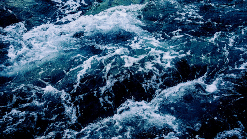 Dramatic sea waves storm from aerial view.