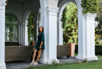 A smiling, sophisticated girl in a turquoise
