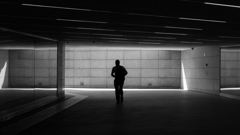 Silhouette of a man walking in a