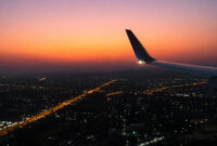aircraft wing in the sky with sunset