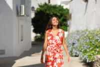 Front view portrait of a happy tourist