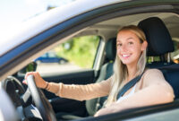 A car driver woman happy owner of