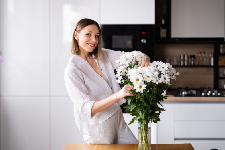 Happy and joyful young woman in white