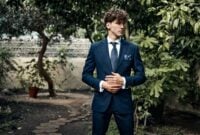 Handsome male model in blue suit standing