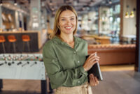 Woman manager in casual clothes standing with