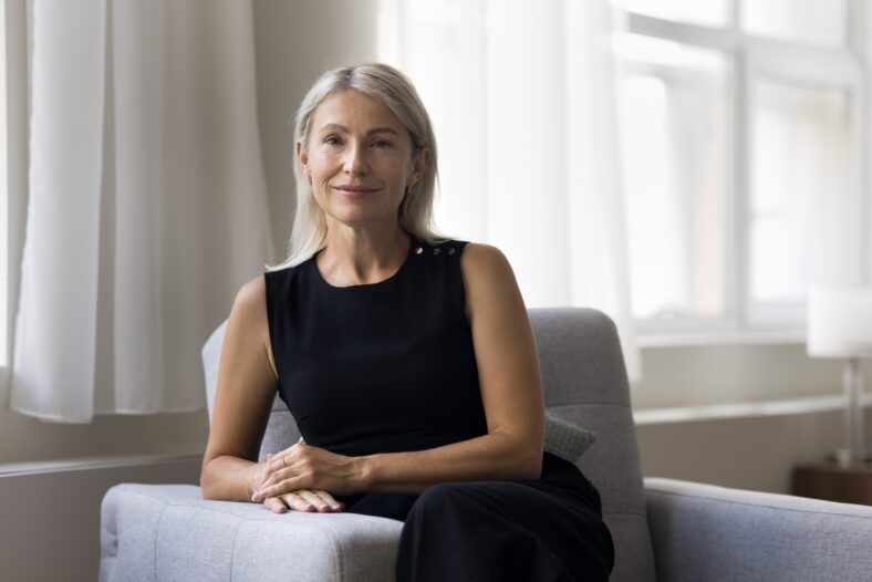 Portrait of beautiful middle-aged woman smile look