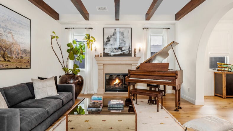 living room with furniture, wood ceiling and art on the wall