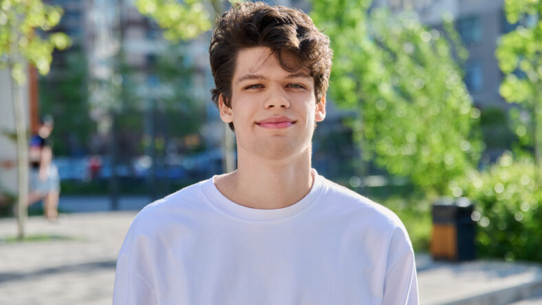 Headshot portrait of smiling, handsome student guy
