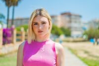 Young pretty blonde woman at outdoors .
