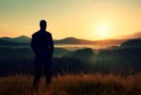 Tall hiker stand on meadow with golden