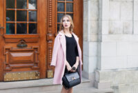 Young beautiful woman standing on the street.