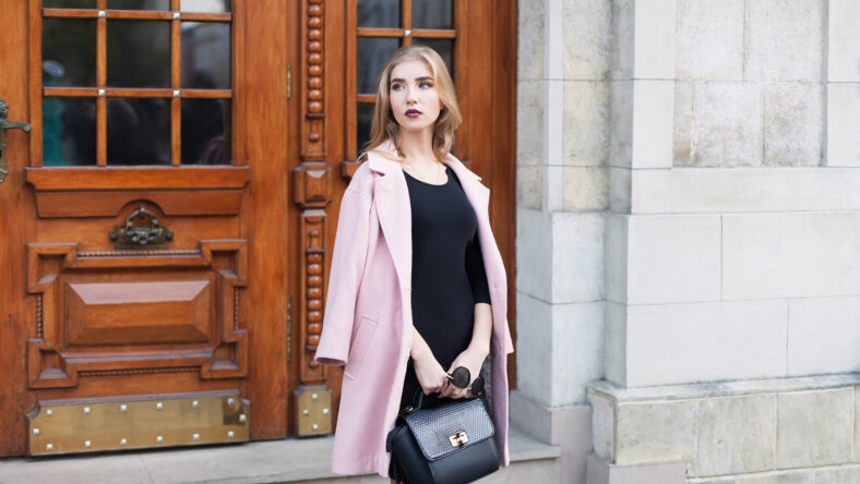 Young beautiful woman standing on the street.