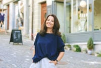 Outdoor portrait of happy mature woman posing