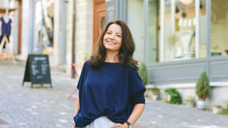 Outdoor portrait of happy mature woman posing