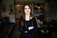 Beautiful young woman in cafe shop. Indoors
