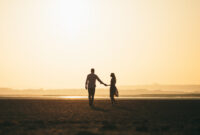 Couple in love walking on the beach