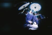 Group of surgeons in hospital operating theater.