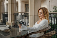 A woman in a white sweater sits
