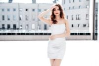 Young beautiful serious brunette female in trendy