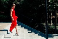 Elegant blonde woman in a flowing red