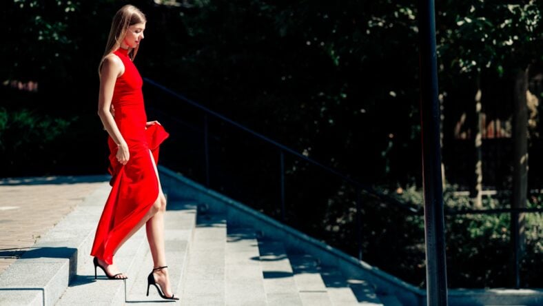 Elegant blonde woman in a flowing red