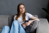 Smiling young lady chatting in social networks,
