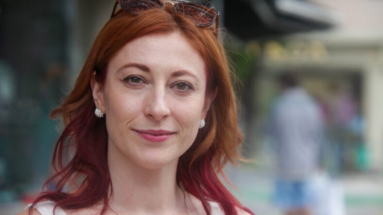 Natural portrait of a confident smiling redhead