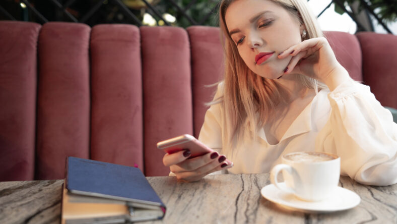 Cafe city lifestyle woman on phone drinking