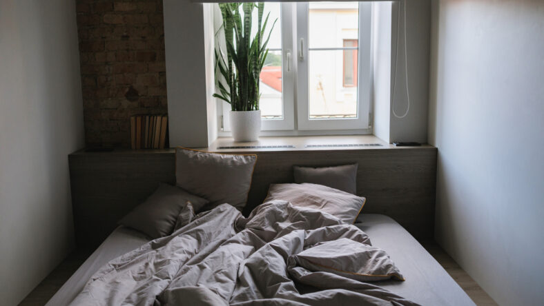 A cozy bedroom interior with a messy