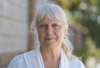 Portrait of a beautiful middle-aged woman outdoors.
